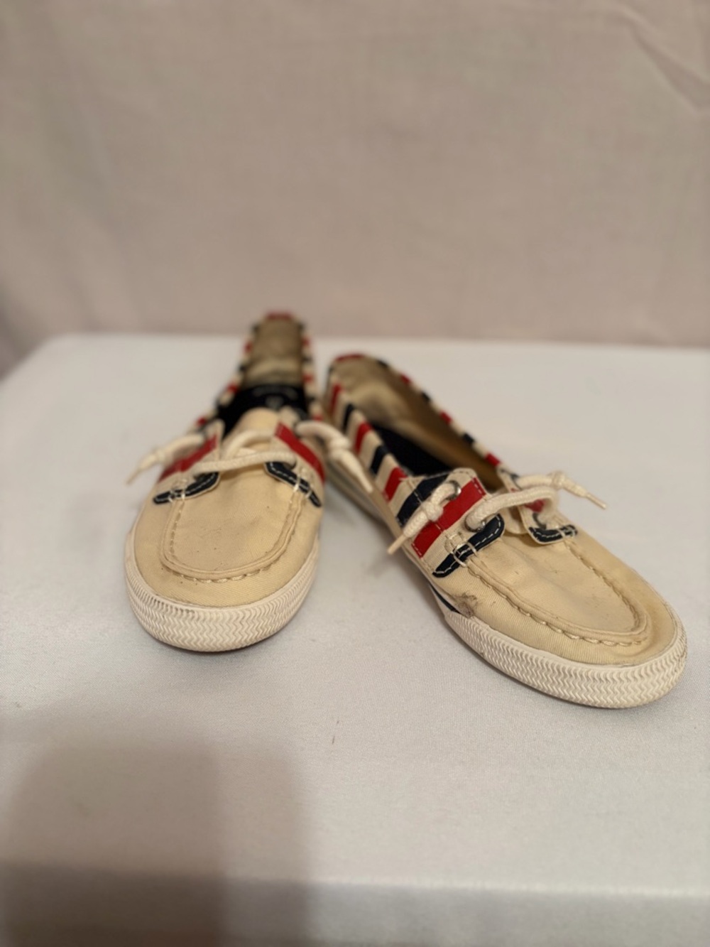 Sperry Lounge Away sneakers in a natural, red, and blue stripes